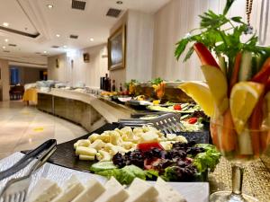 a buffet line with many plates of food at Askoc Hotel & SPA in Istanbul