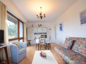 a living room with a couch and a table at Charmant appartement proche du lac avec Wi-Fi et parking à Évian-les-Bains - FR-1-498-96 in Évian-les-Bains