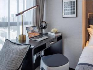 TV i/ili zabavni centar u objektu Millenia Executive Apartment Guangzhou East Railway Station Zhujiang New Town Branch - Free Shuttle Bus to Canton Fair Complex During Canton Fair Period