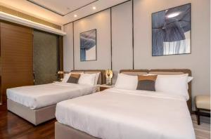 Krevet ili kreveti u jedinici u objektu Millenia Executive Apartment Guangzhou East Railway Station Zhujiang New Town Branch - Free Shuttle Bus to Canton Fair Complex During Canton Fair Period