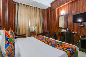 Postel nebo postele na pokoji v ubytování FabHotel Prime The Rivlet MG Road