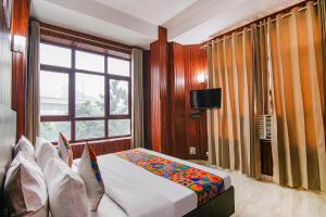 TV a/nebo společenská místnost v ubytování FabHotel Prime The Rivlet MG Road
