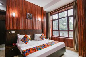 Postel nebo postele na pokoji v ubytování FabHotel Prime The Rivlet MG Road