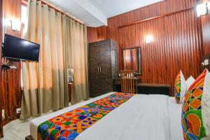 Postel nebo postele na pokoji v ubytování FabHotel Prime The Rivlet MG Road
