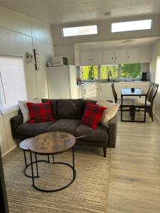 a living room with a couch and a table at Cozy Guest House in Bellingham