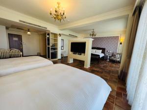 Letto o letti in una camera di Kenting Moli Bay Seaview Resort Hotel