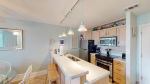 a kitchen with a white counter top in a room at VILLA 315 - The Eagles Nest condo in Jekyll Island