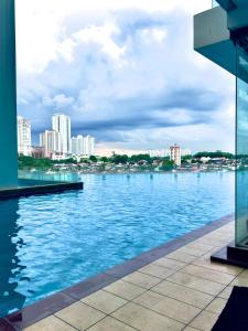 a view of a large body of water with buildings at JB City Shopping Mall Apartment in Johor Bahru