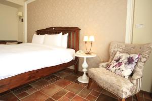 Letto o letti in una camera di Kenting Moli Bay Seaview Resort Hotel