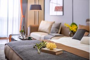 Katil atau katil-katil dalam bilik di Millenia Executive Apartment Guangzhou East Railway Station Zhujiang New Town Branch - Free Shuttle Bus to Canton Fair Complex During Canton Fair Period