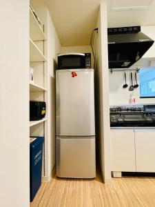 3-3札幌駅徒歩8分　美室【サービスアパートメントSAPPORO札幌駅西】エアコン完備にあるキッチンまたは簡易キッチン