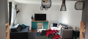 Telewizja i/lub zestaw kina domowego w obiekcie Lodge Loupau Maga