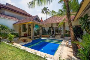 an image of a villa with a swimming pool at Villa CHANDI 2 - Legian - Seminyak - 5 Bedroom 4 Bathroom Villa - Great Location ! in Seminyak
