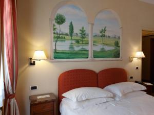 Postel nebo postele na pokoji v ubytování PHI Hotel Canalgrande