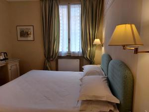 Postel nebo postele na pokoji v ubytování PHI Hotel Canalgrande