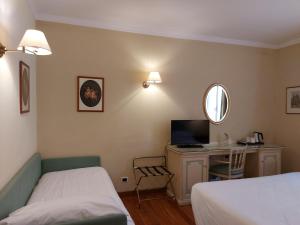 Postel nebo postele na pokoji v ubytování PHI Hotel Canalgrande
