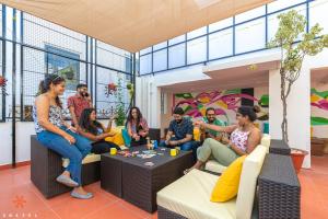 a group of people sitting in a room at Zostel Bangalore (Koramangala) in Bangalore