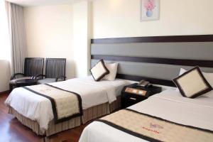 Postel nebo postele na pokoji v ubytování Angella Hotel + 37 fotografií