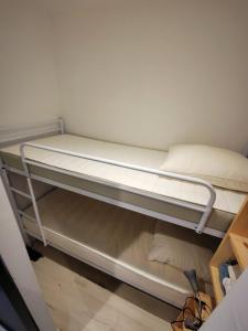 a bunk bed in a small room at Studio cabine vue port in Le Grau-du-Roi