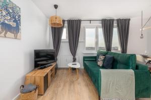 Posedenie v ubytovaní Apartment Near the Warta River by Noclegi Renters