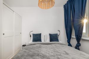 Posteľ alebo postele v izbe v ubytovaní Apartment Near the Warta River by Noclegi Renters
