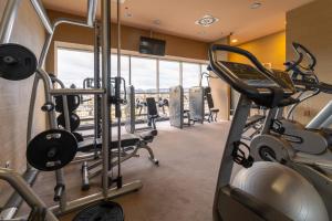 a gym with treadmills and elliptical machines at Holiday Inn Zilina, an IHG Hotel in Žilina