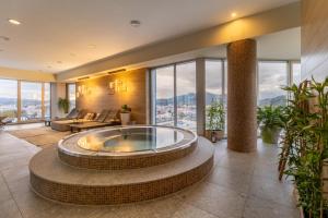 a living room with a large tub in the middle at Holiday Inn Zilina, an IHG Hotel in Žilina