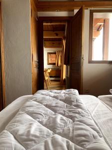 Łóżko lub łóżka w pokoju w obiekcie Exclusive Chalet Val Thorens Center by GlobalSki
