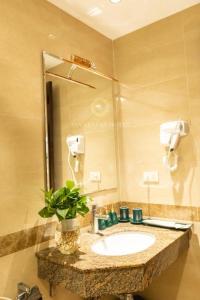 a bathroom with a sink and a mirror at Hotel No 9 Nguyễn Trường Tộ - by Bay Luxury in Hanoi