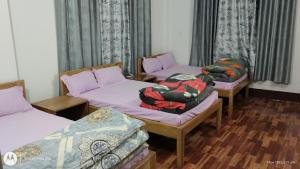 Postel nebo postele na pokoji v ubytování Meera homestay + 3 fotografie