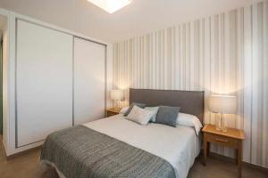 Postel nebo postele na pokoji v ubytování Apartamento Capri IV Vistabella golf