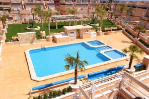 Der Swimmingpool an oder in der Nähe von Duplex campoamor heated pool