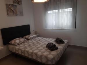 Postel nebo postele na pokoji v ubytování groundfloor family house lo pagan + 13 fotografií