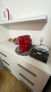 a red appliance sitting on top of a counter at STANZA CORSICA in Alghero