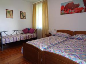 Postelja oz. postelje v sobi nastanitve B&B Casa Perini