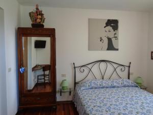 Postel nebo postele na pokoji v ubytování B&B Casa Perini
