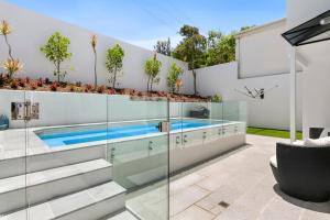 a swimming pool in the backyard of a house at Seashells on Sunrise, Sunrise Beach in Sunrise Beach