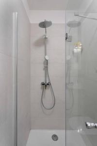 a shower with a glass door in a bathroom at Luxury & Elegance 2BDR Apartment in Zagreb