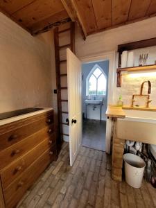 a kitchen with a sink and a sink at The Lookout: Cosy Compact Cottage in Totland