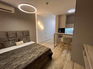 Postel nebo postele na pokoji v ubytování APARTMANI PENTHOUSE BULEVAR