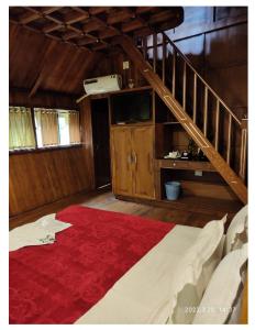 Postel nebo postele na pokoji v ubytování Tree House Wayanad + 37 fotografií