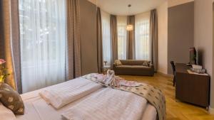Posteľ alebo postele v izbe v ubytovaní Wellness & Spa hotel Villa Regenhart