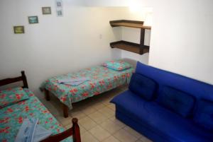 Casa de Dona Rosa tesisinde bir odada yatak veya yataklar