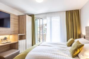 En eller flere senger på et rom på Hotel Bristol