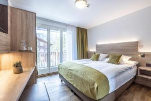 En eller flere senger på et rom på Hotel Bristol