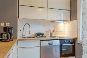 A cozinha ou cozinha compacta de Le Flambelle - Charmant 2 pièces avec parking