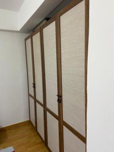 a room with three sliding doors in a room at شقة in Cairo