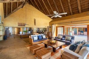 a large living room with couches and a table at Collection Luxury Accommodation: Quinta Do Sol, Vilanculos, Mozambique in Vilanculos