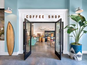 a coffee shop with a surfboard inside of it at Margaritaville Hotel San Diego Gaslamp Quarter in San Diego