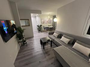 a living room with a couch and a table at Grandes Playas Haven in Corralejo